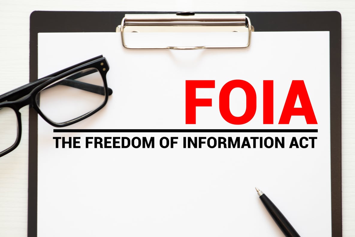 Paper with The Freedom of Information Act FOIA on a table