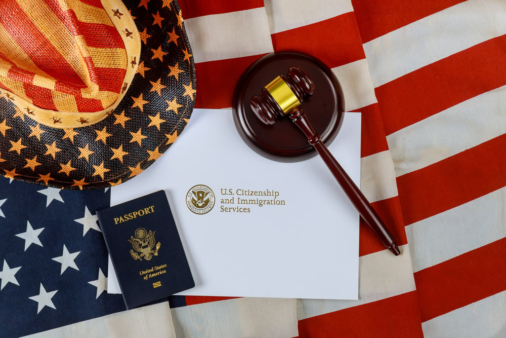 Judge's Gavel and Immigration Mail on American Flag
